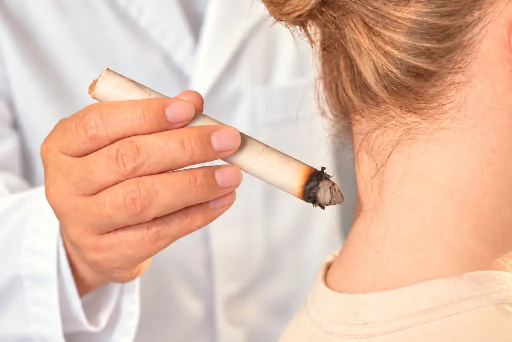 An acupuncturist using moxibustion to treat neck pain